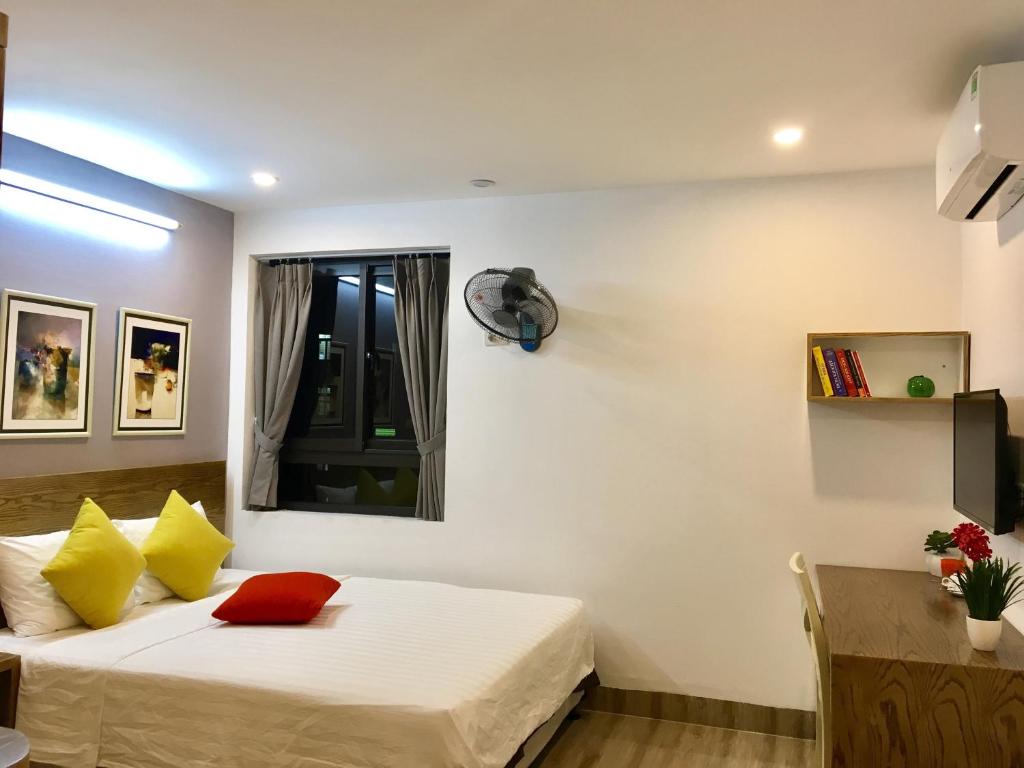 Postel nebo postele na pokoji v ubytování V House 5 Serviced Apartment