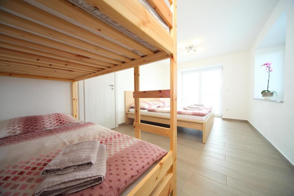Postel nebo postele na pokoji v ubytování Apartments Planica
