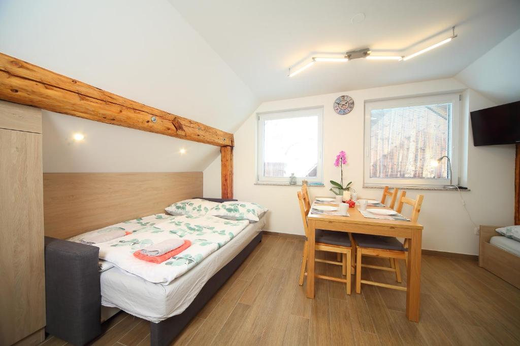 Postel nebo postele na pokoji v ubytování Apartments Planica