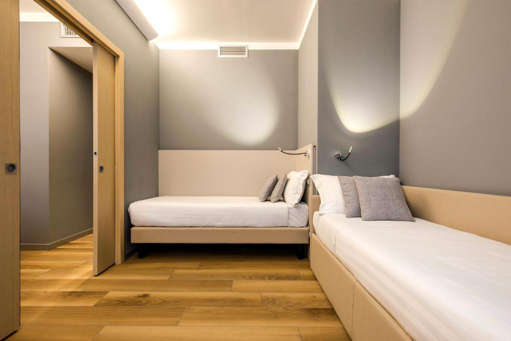 Postel nebo postele na pokoji v ubytování 43 Station Hotel