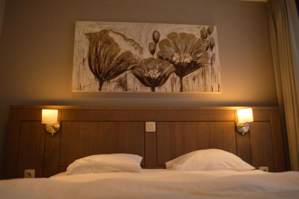 Postel nebo postele na pokoji v ubytování Hotel Honfleur
