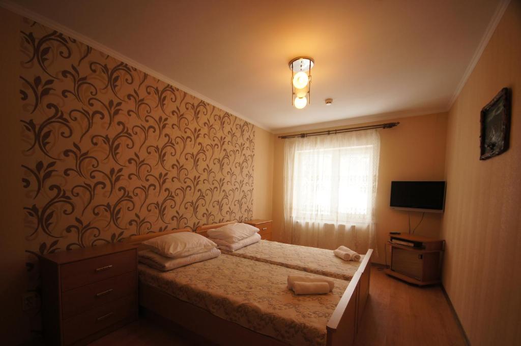Postel nebo postele na pokoji v ubytování Zirka Karpat