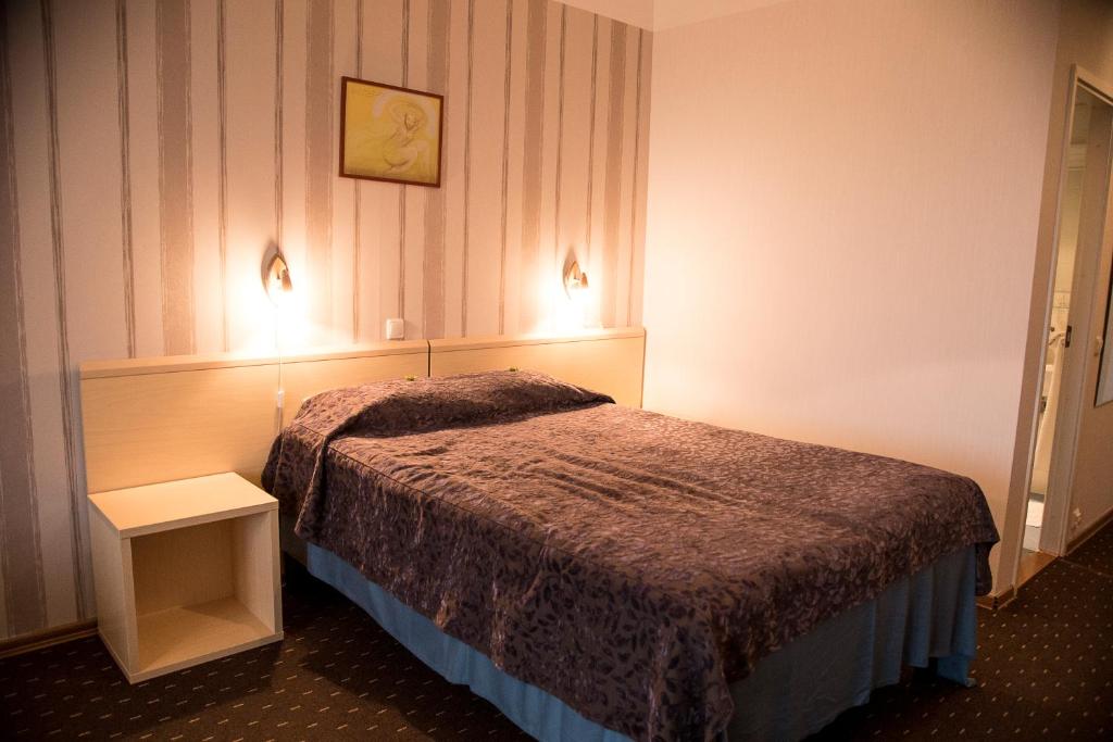 Postel nebo postele na pokoji v ubytování Hotell Tamula