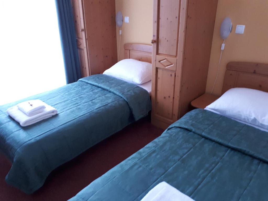 Postel nebo postele na pokoji v ubytování Hotel Rakov Skocjan