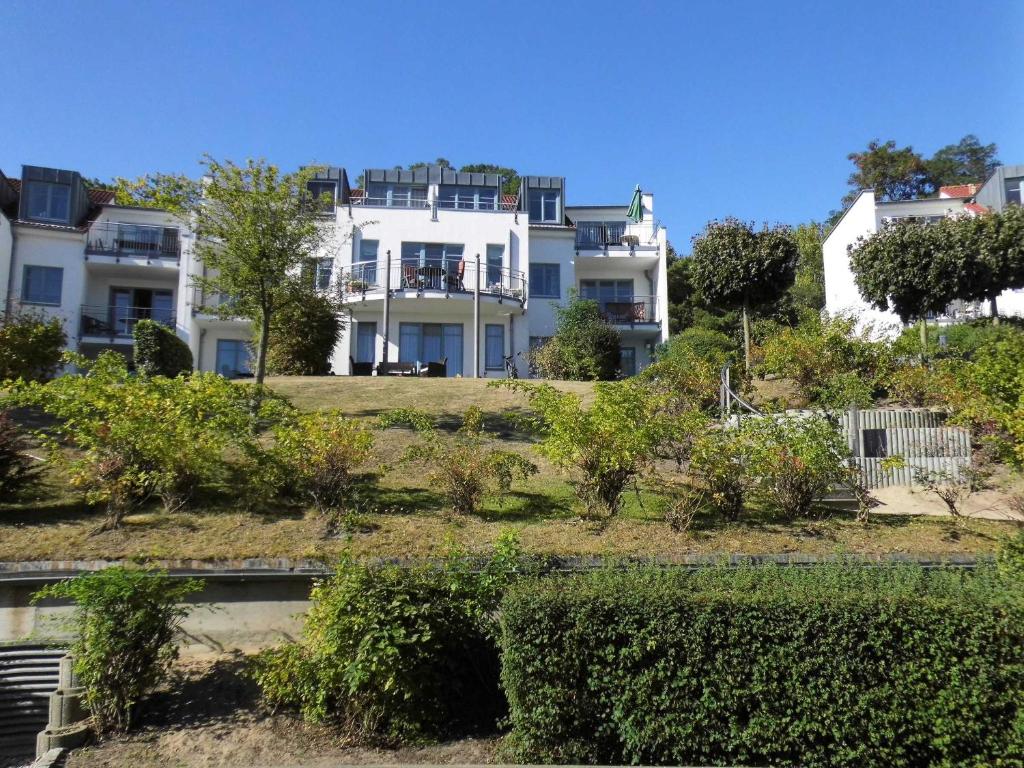 a group of houses on a hill with bushes at Appartement Residenz Bellevue Whg 22 in Zinnowitz