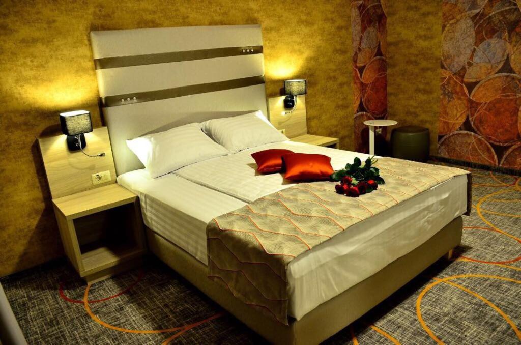 Postel nebo postele na pokoji v ubytování Hotel Baril