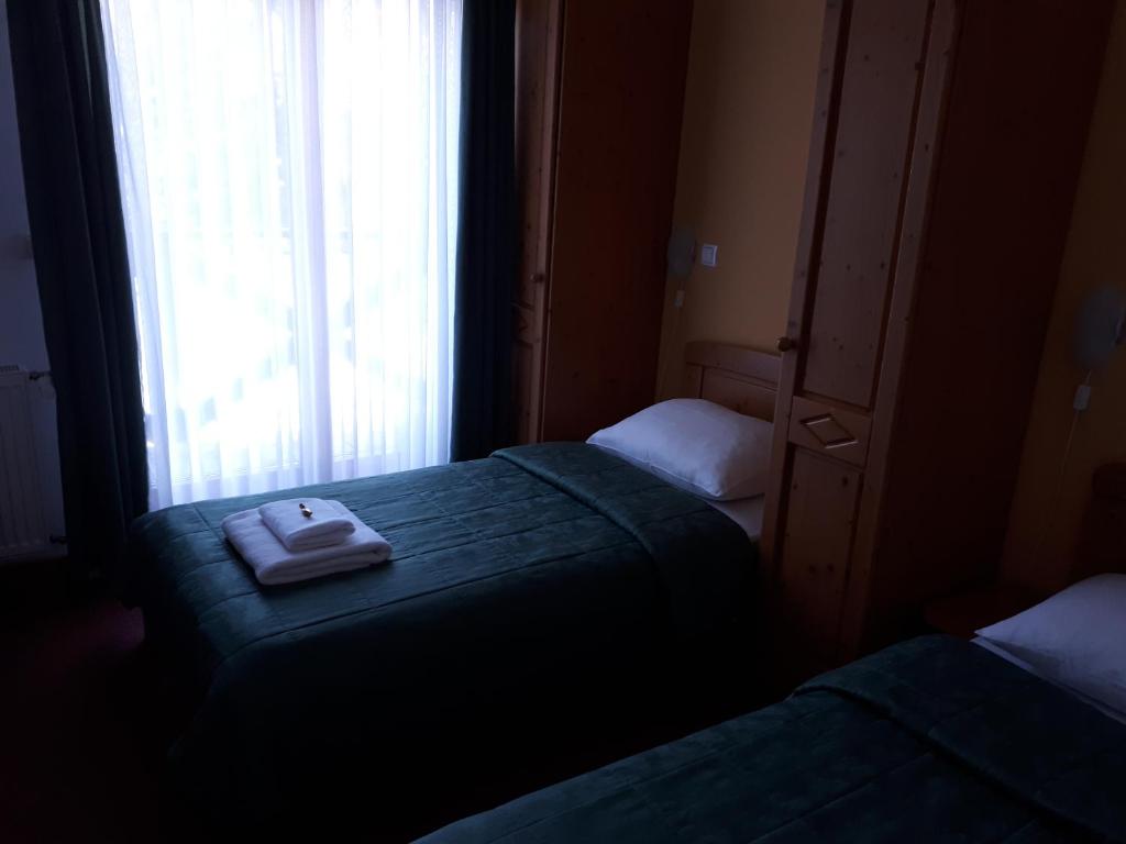 Postel nebo postele na pokoji v ubytování Hotel Rakov Skocjan