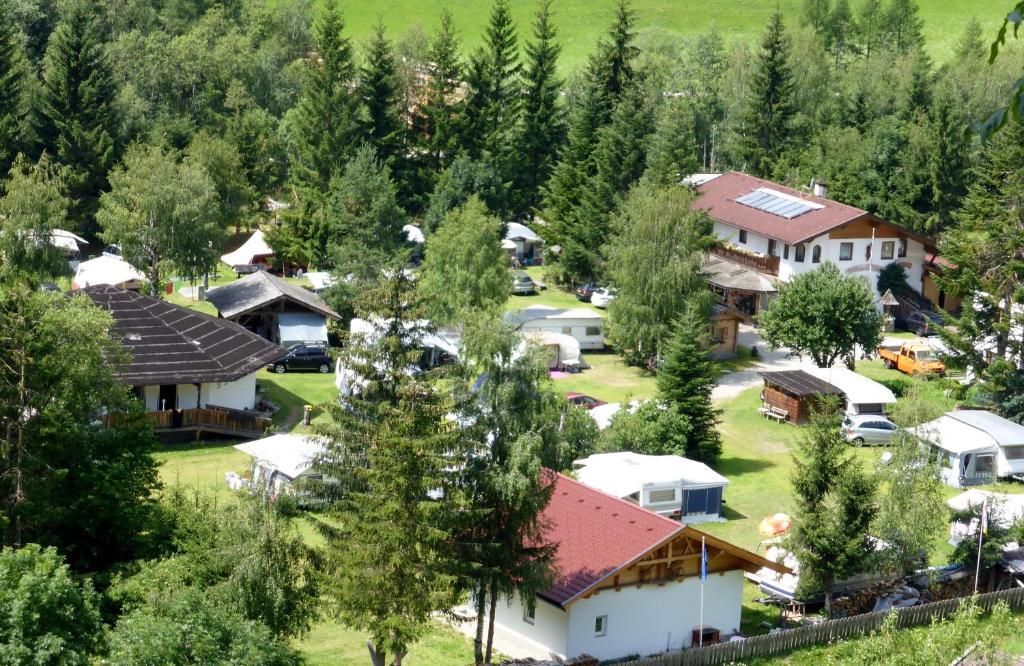 an aerial view of a village with houses and trees at Haus Julia in Großkirchheim