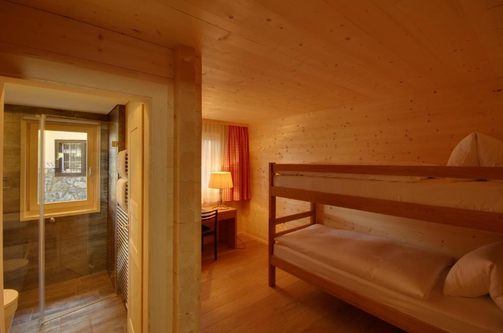 Postel nebo postele na pokoji v ubytování Schatzalp Hotel