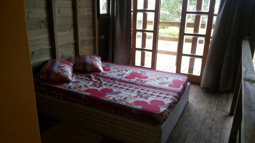 Postel nebo postele na pokoji v ubytování Cabana Rústica Praia do Sonho