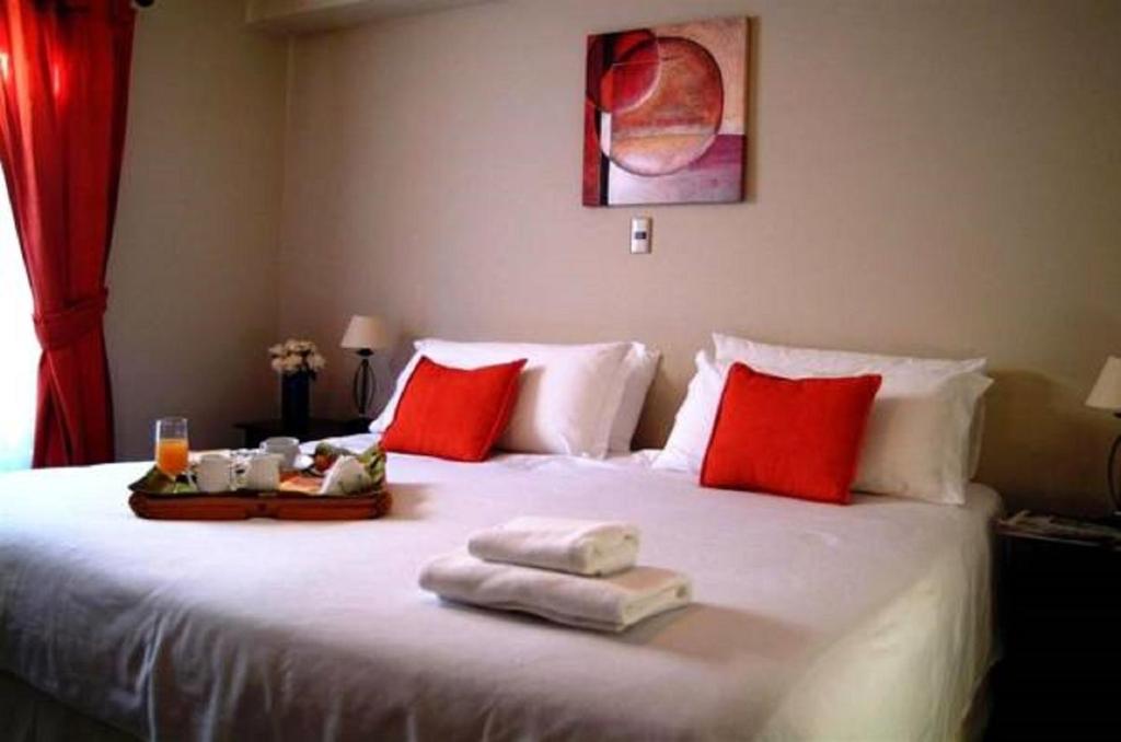 Postel nebo postele na pokoji v ubytování Hotel Carpa Manzano