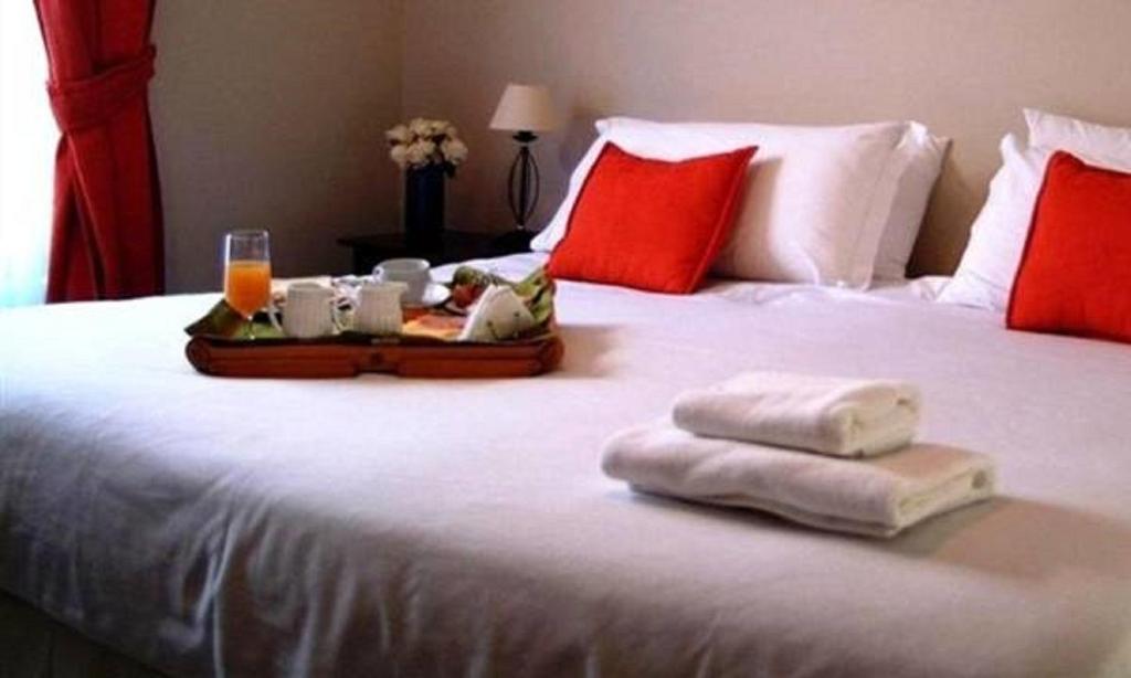 Postel nebo postele na pokoji v ubytování Hotel Carpa Manzano