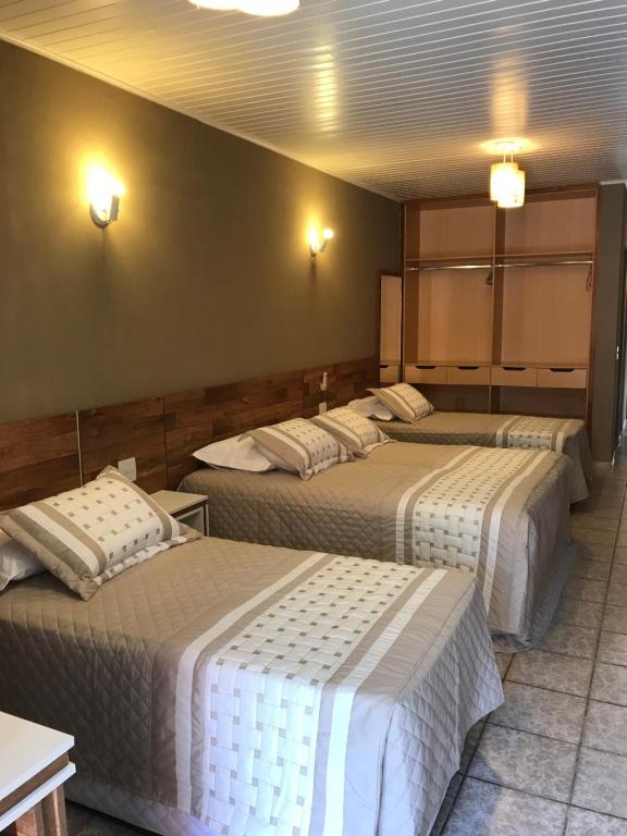 Cama ou camas em um quarto em Amoreiras Hotel Pousada