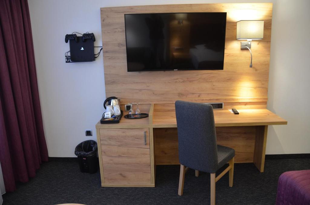 TV a/nebo společenská místnost v ubytování Hotel Touric