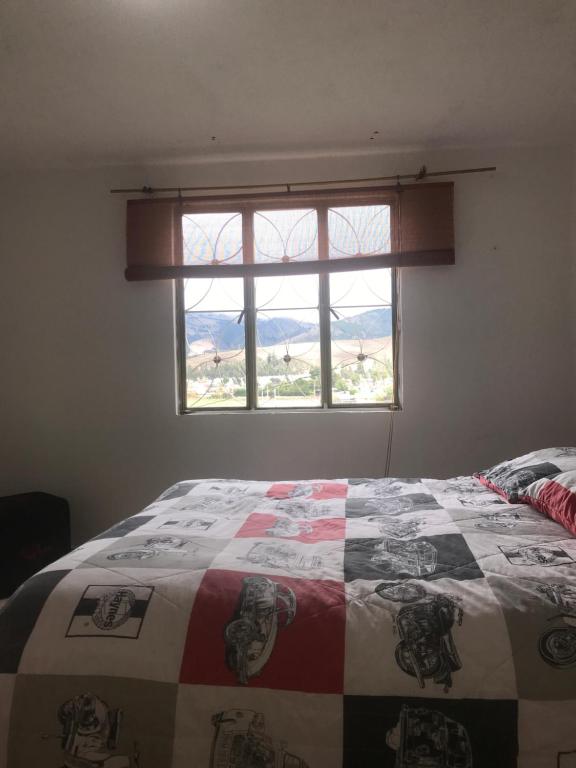 Postel nebo postele na pokoji v ubytování Hostal Casa Lantana