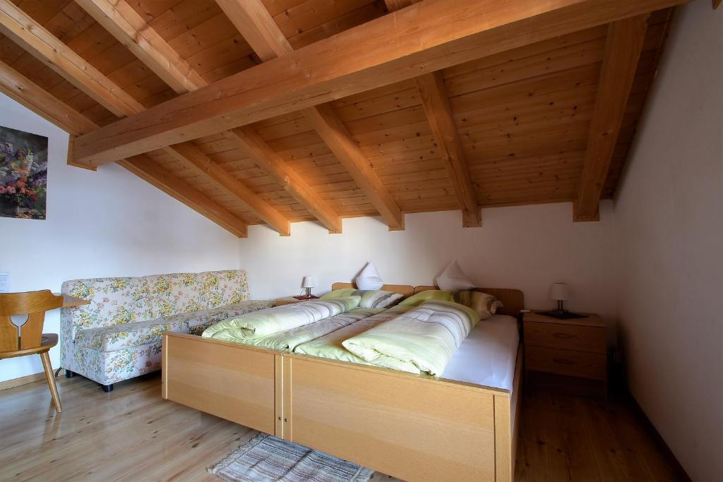 Postel nebo postele na pokoji v ubytování Pension Mirandola