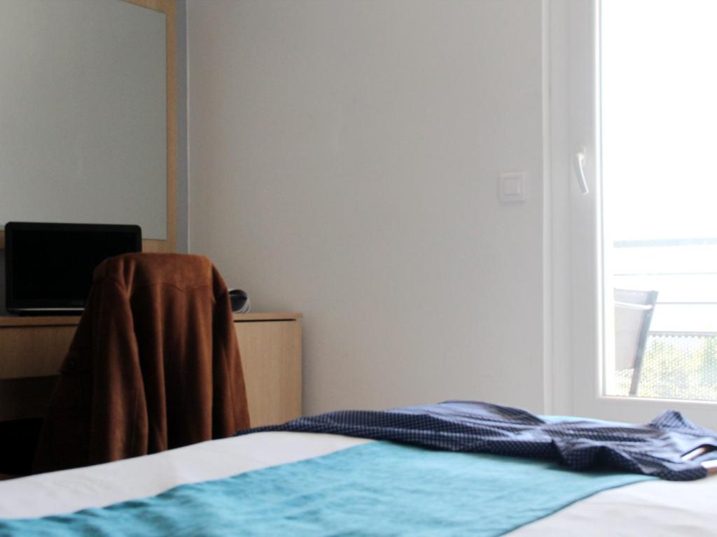 Voodi või voodid majutusasutuse Saglam Hôtel toas