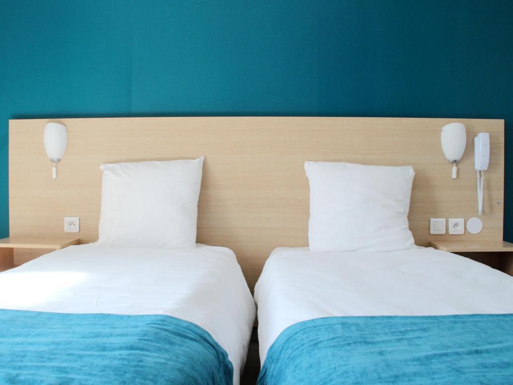 Voodi või voodid majutusasutuse Saglam Hôtel toas