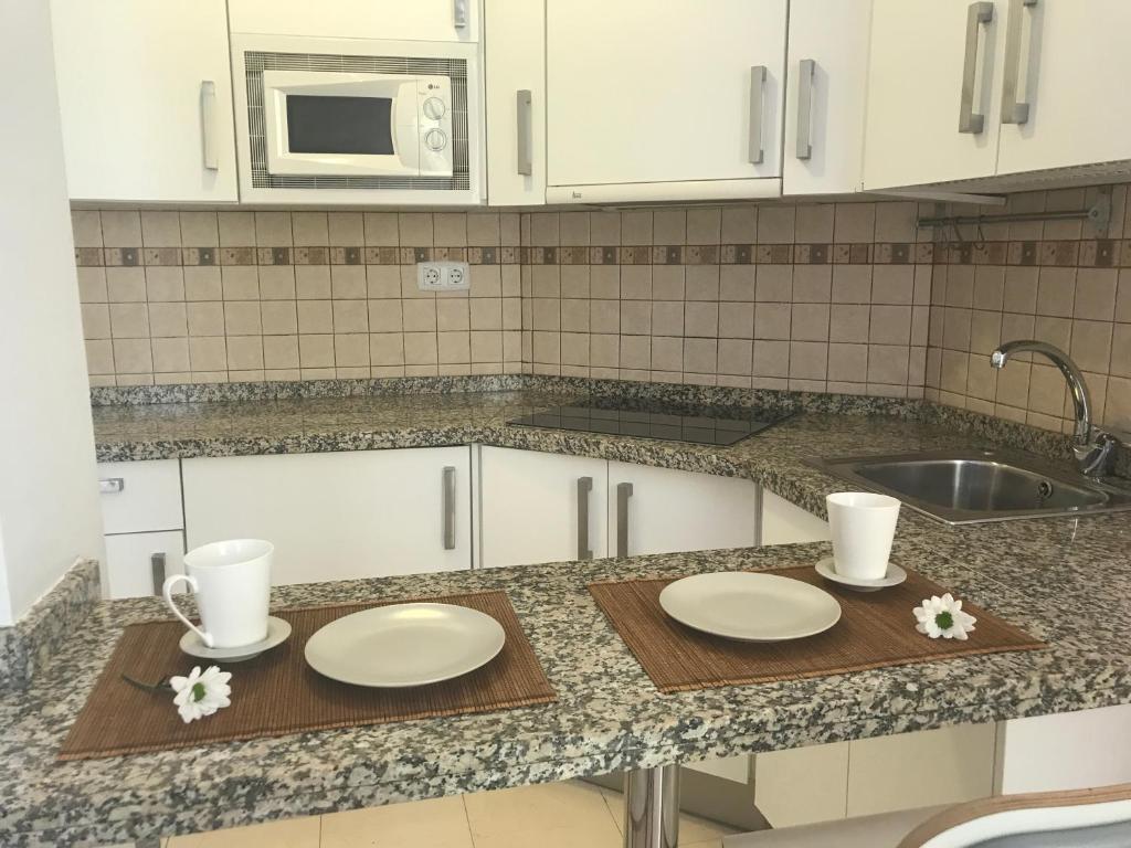 Kuchyňa alebo kuchynka v ubytovaní MALAMA Apartamentos Turísticos