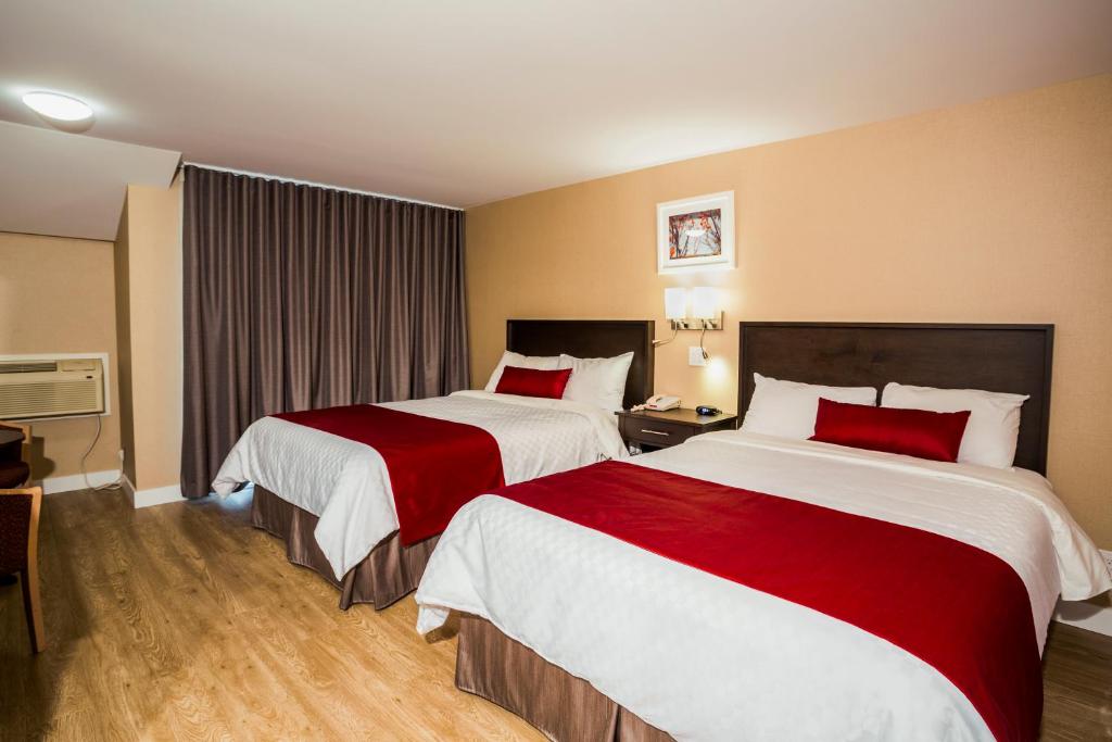 Postel nebo postele na pokoji v ubytování Hotel Bromont