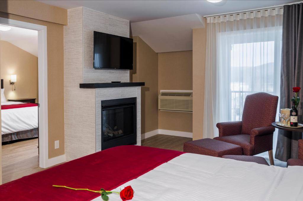 Postel nebo postele na pokoji v ubytování Hotel Bromont
