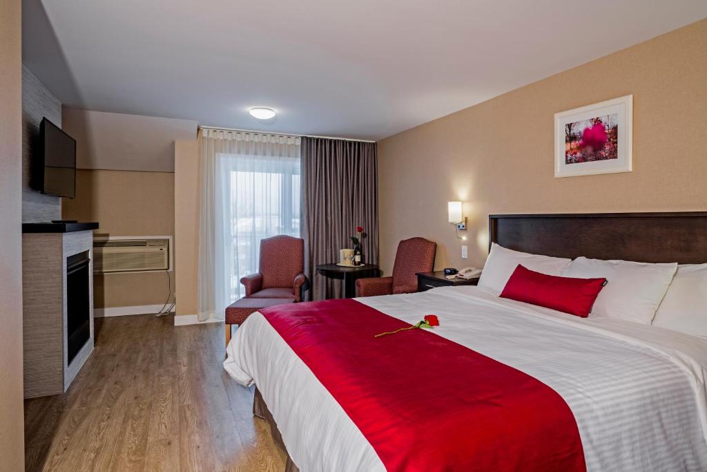 Postel nebo postele na pokoji v ubytování Hotel Bromont