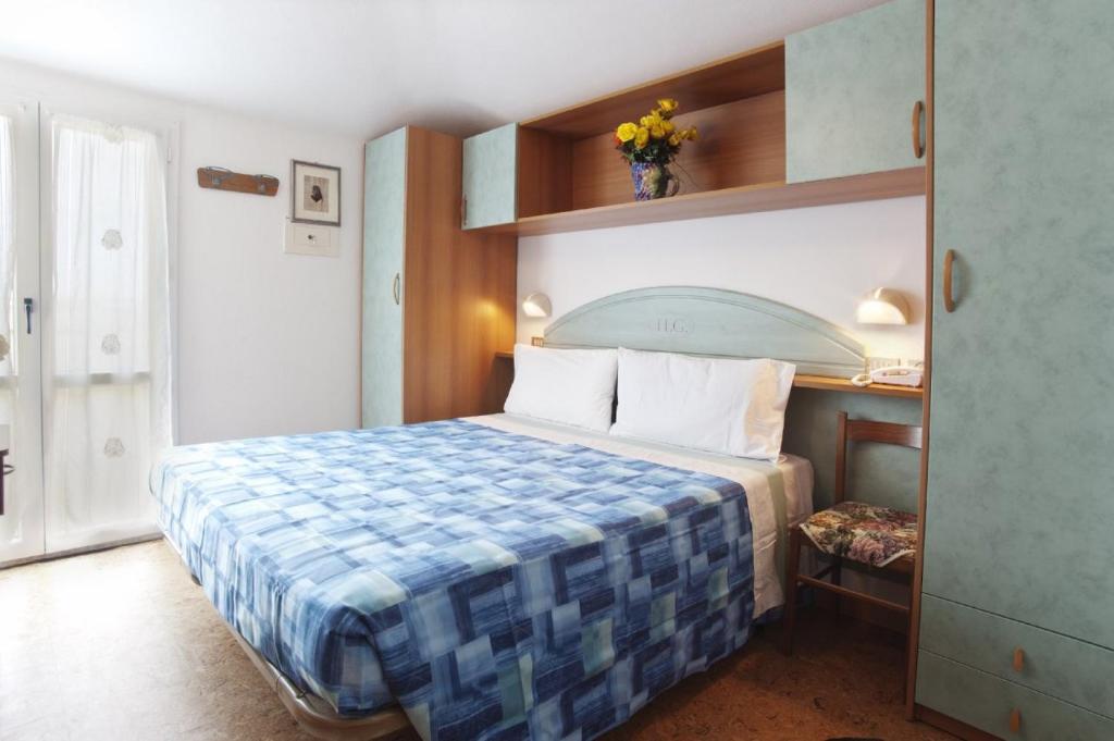 Postel nebo postele na pokoji v ubytování Hotel Giunchi