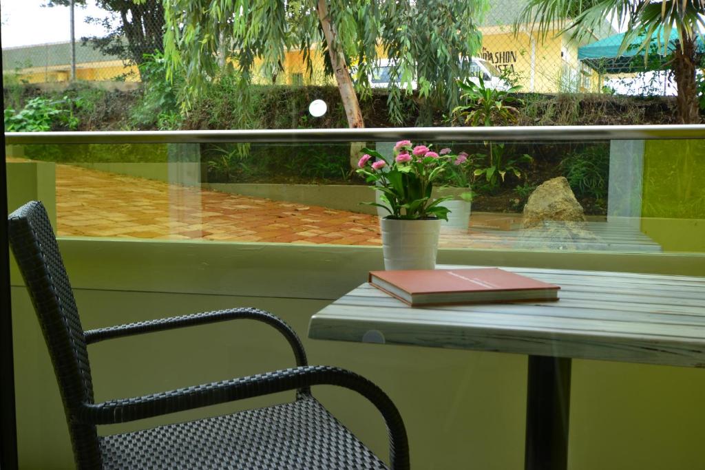 a table with a book and a book at Quints Travelers Inn in Willemstad