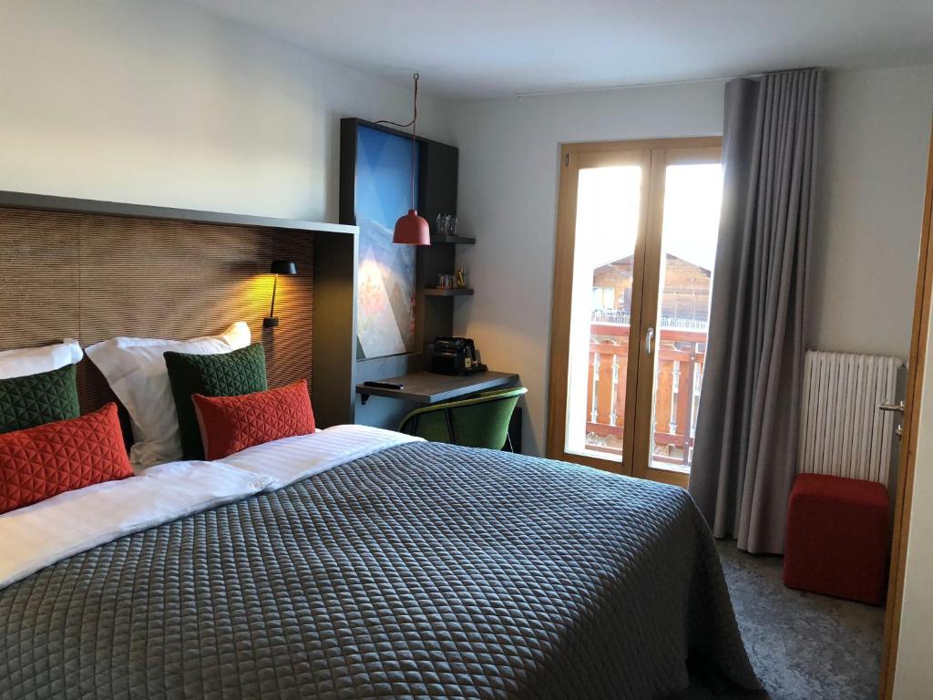 Postel nebo postele na pokoji v ubytování Hotel Les Etagnes