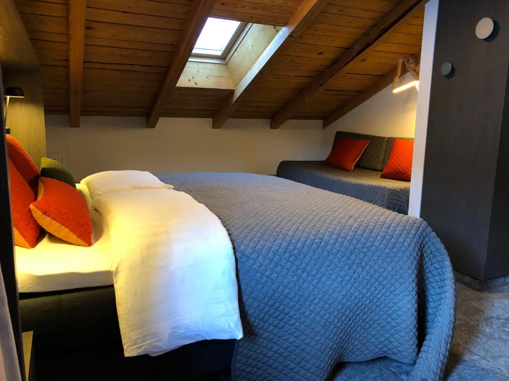 Postel nebo postele na pokoji v ubytování Hotel Les Etagnes