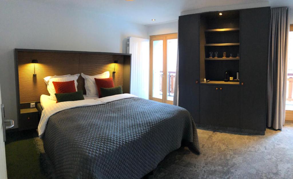 Postel nebo postele na pokoji v ubytování Hotel Les Etagnes
