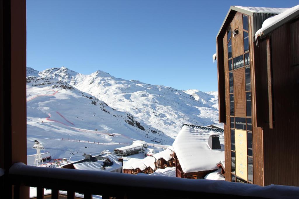 a view of a snow covered mountain from a building at Silveralp in Val Thorens