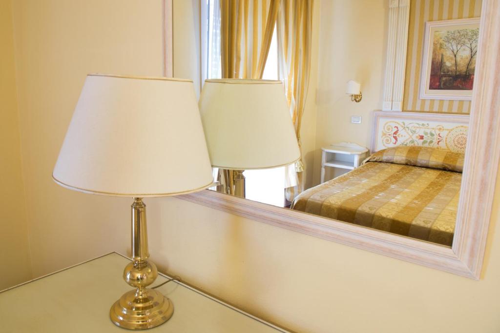 Postel nebo postele na pokoji v ubytování Hotel Tuder