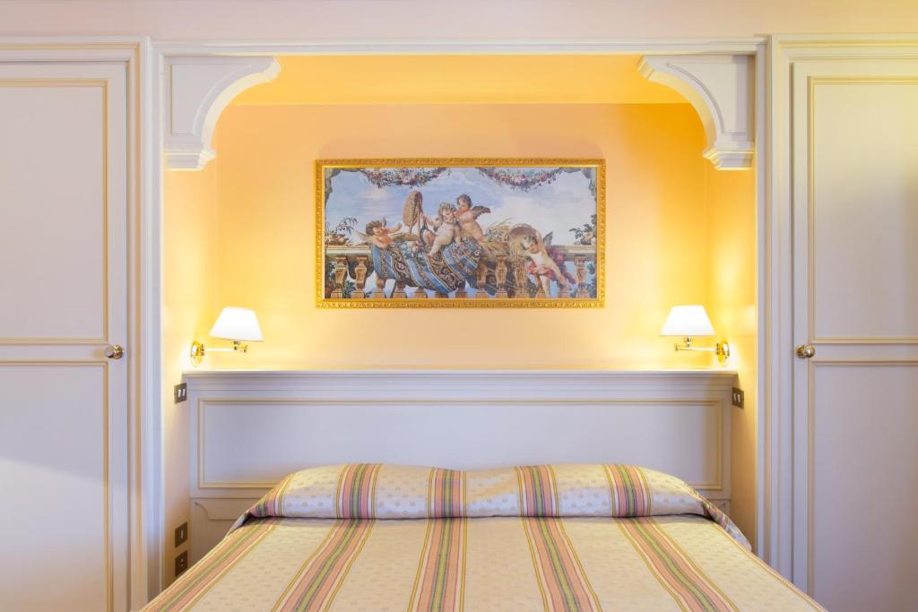 Postel nebo postele na pokoji v ubytování Hotel Tuder