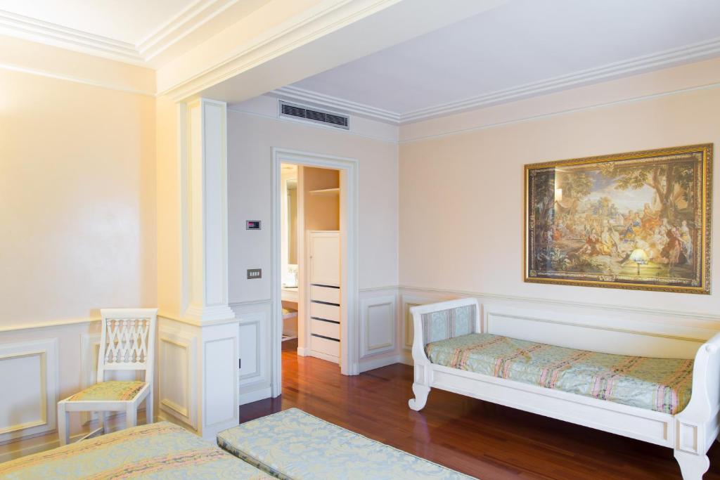 Postel nebo postele na pokoji v ubytování Hotel Tuder