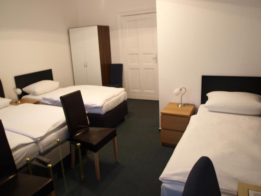 Postel nebo postele na pokoji v ubytování Hotel-Pension Dorma