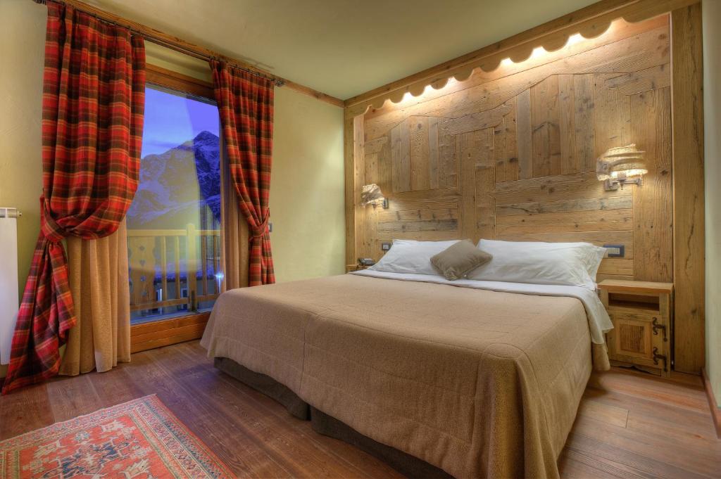 Postel nebo postele na pokoji v ubytování Hotel Meublé Mon Rêve