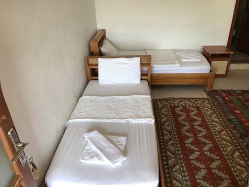 Postel nebo postele na pokoji v ubytování Sahil Pension