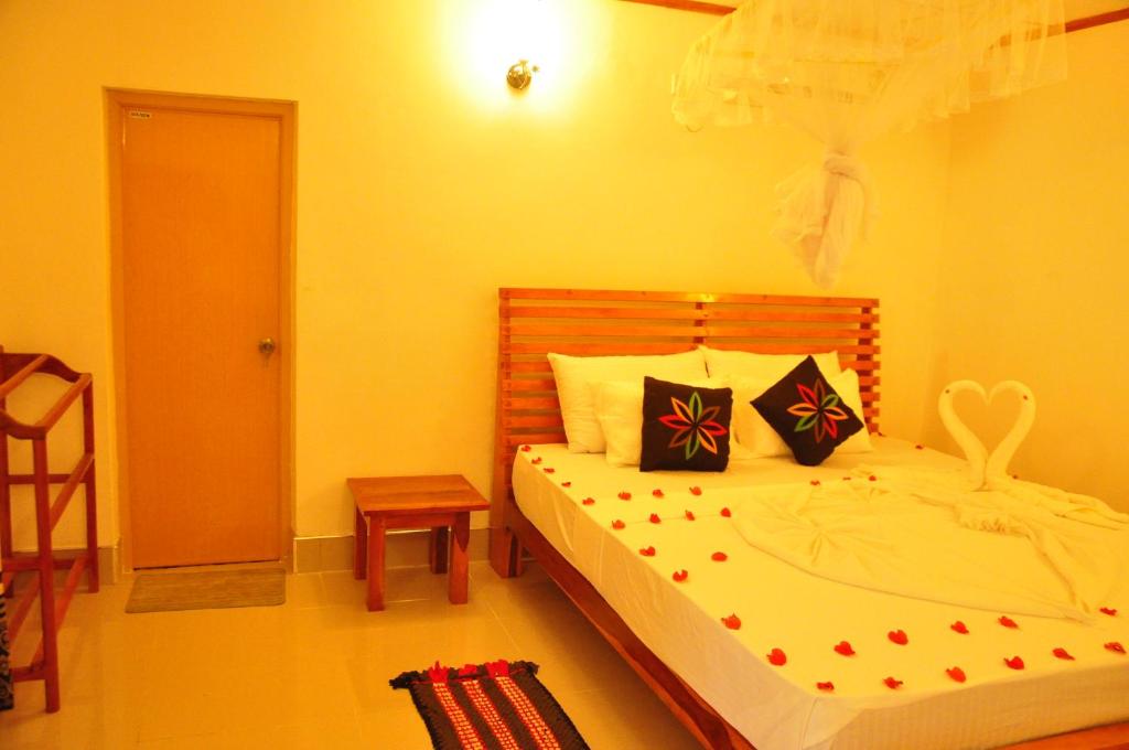 Postel nebo postele na pokoji v ubytování Rock Lake Home Stay