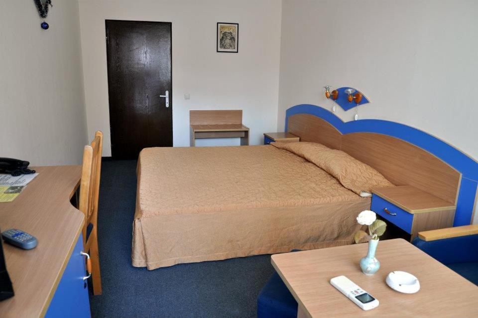 Säng eller sängar i ett rum på Hotel Ogosta