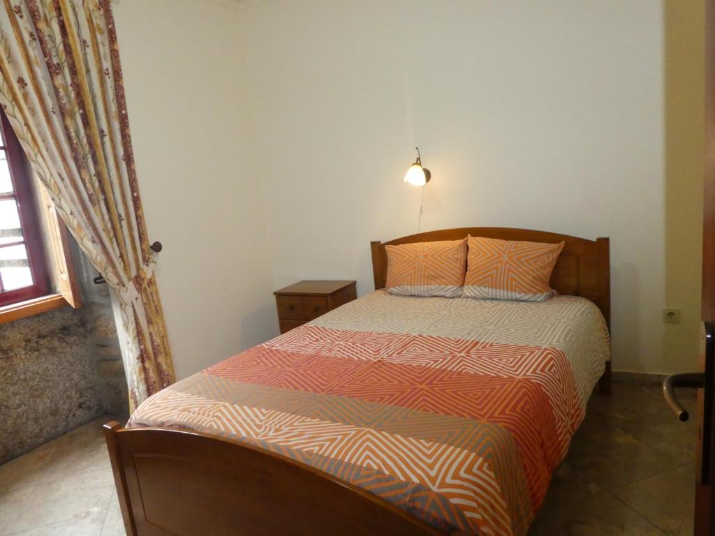 Uma cama ou camas num quarto em Quinta das Cegonhas