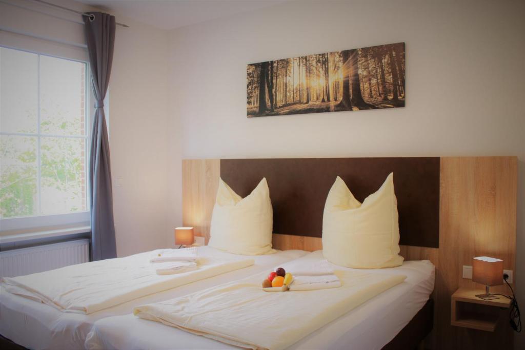 Ein Bett oder Betten in einem Zimmer der Unterkunft Hotel-Restaurant Tüxen
