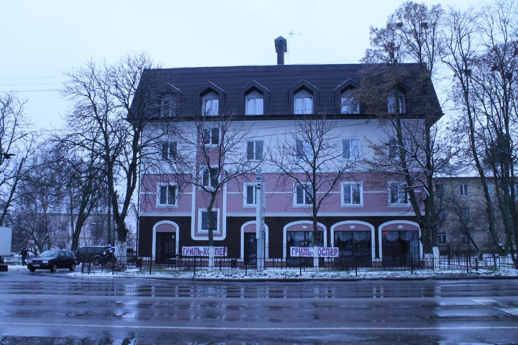 a large house on the side of a street at Non-stop Economy hotel in Boryspil
