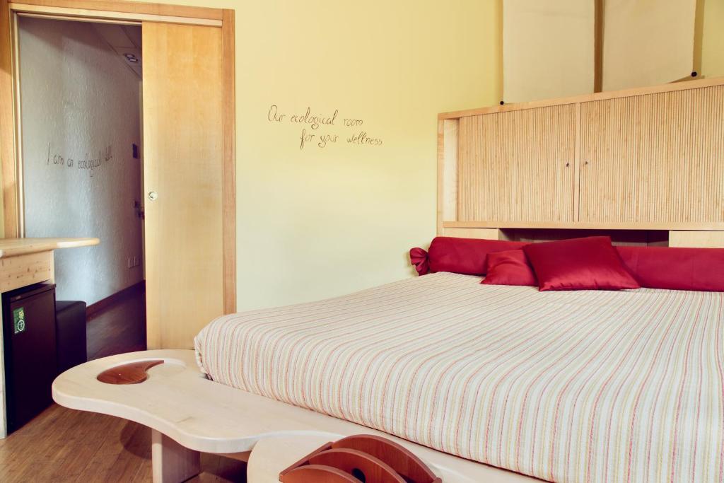 Postel nebo postele na pokoji v ubytování eco Hotel Milano & BioRiso Restaurant