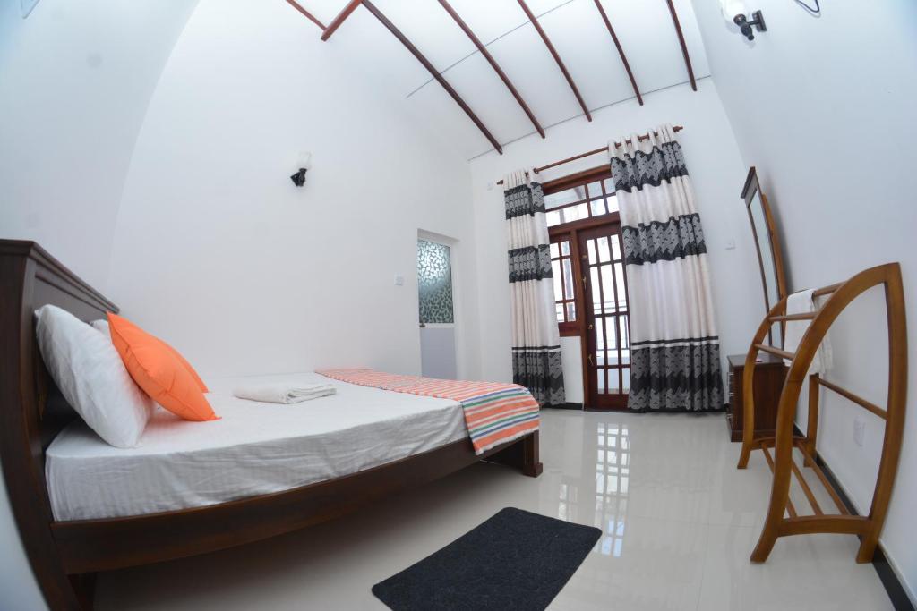 Postel nebo postele na pokoji v ubytování Reshani Guest House