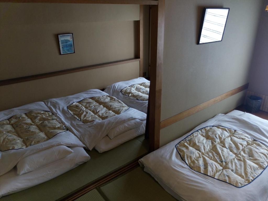 Postel nebo postele na pokoji v ubytování Hotel Edoya
