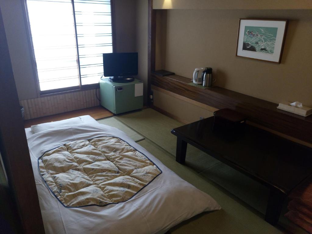 Postel nebo postele na pokoji v ubytování Hotel Edoya
