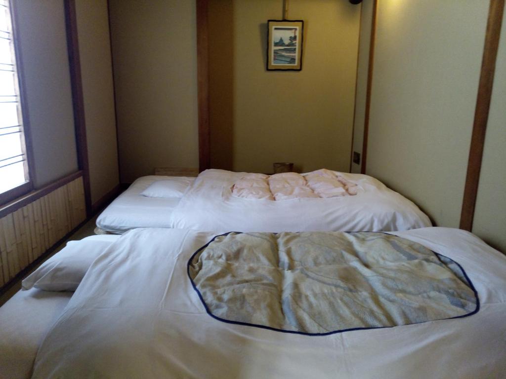 Postel nebo postele na pokoji v ubytování Hotel Edoya