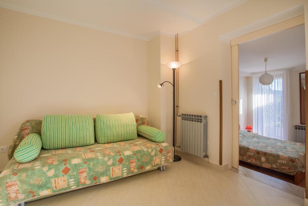 Postel nebo postele na pokoji v ubytování Apartments Ljubo & Lili