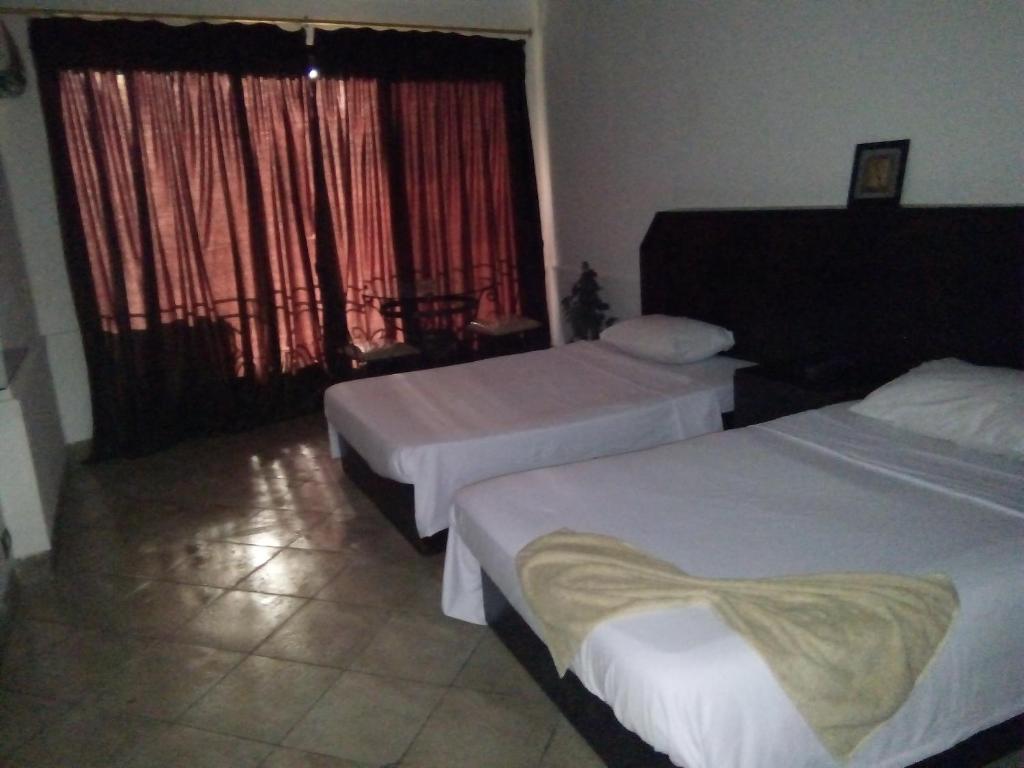 Postel nebo postele na pokoji v ubytování Arabesque Hotel